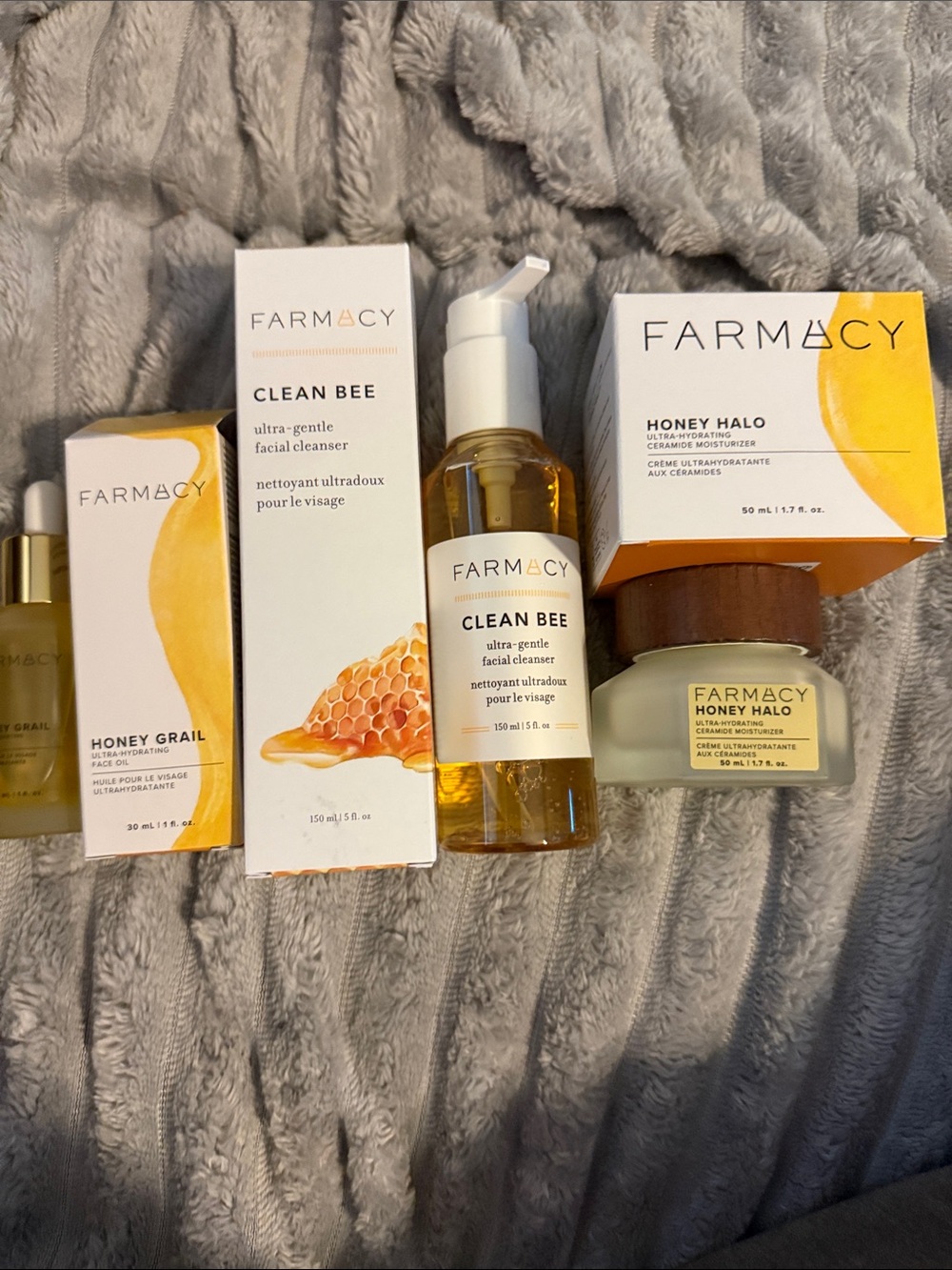 Farmacy skincare set with yellow and white packaging